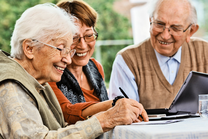 Elderly couple and daughter, making plans